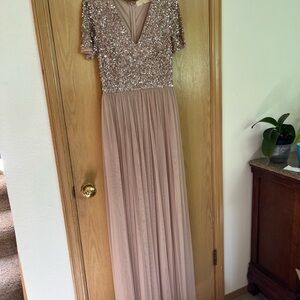 Lovely prom dress. Long for tall girls. Skirt is tulle with a liner under.